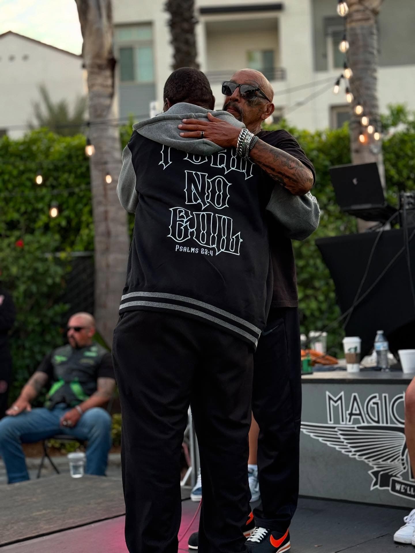 Phil Hugging Black Guy