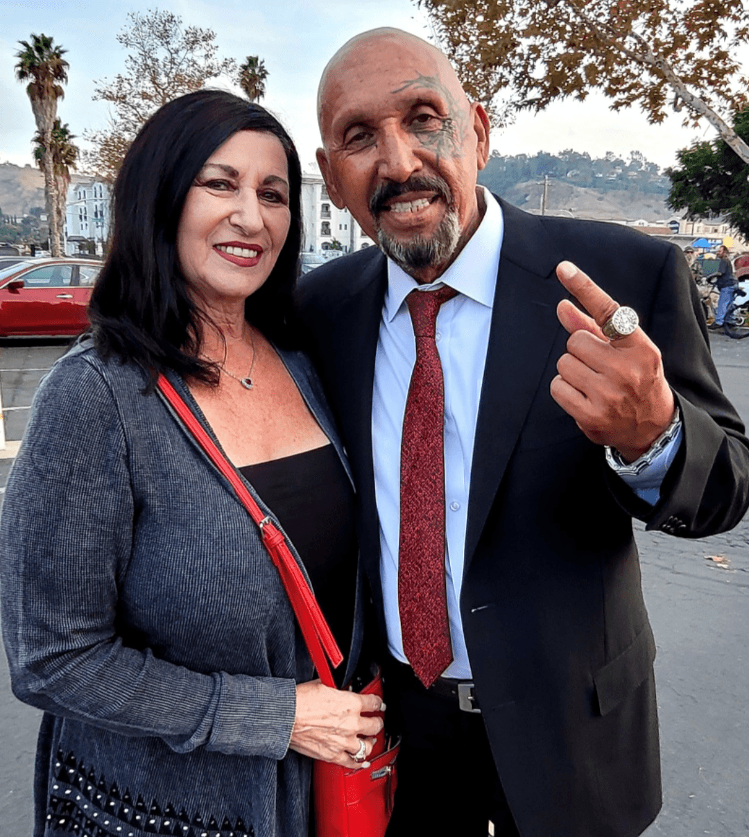 Sandra with Phil wearing a red tie